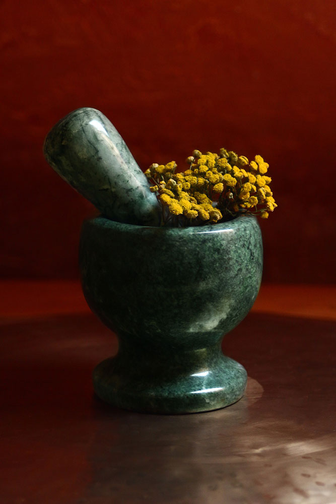 Mortar and pestle and herbs